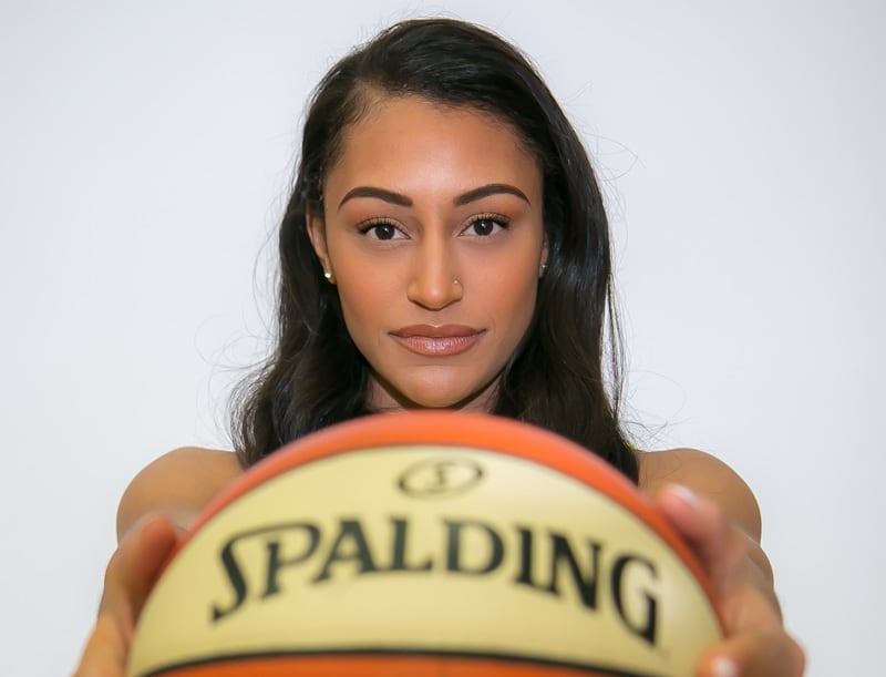 Coach portrait while holding a basketball.